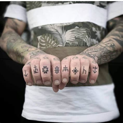 tattoo designs in hand for man|finger tattoos men.